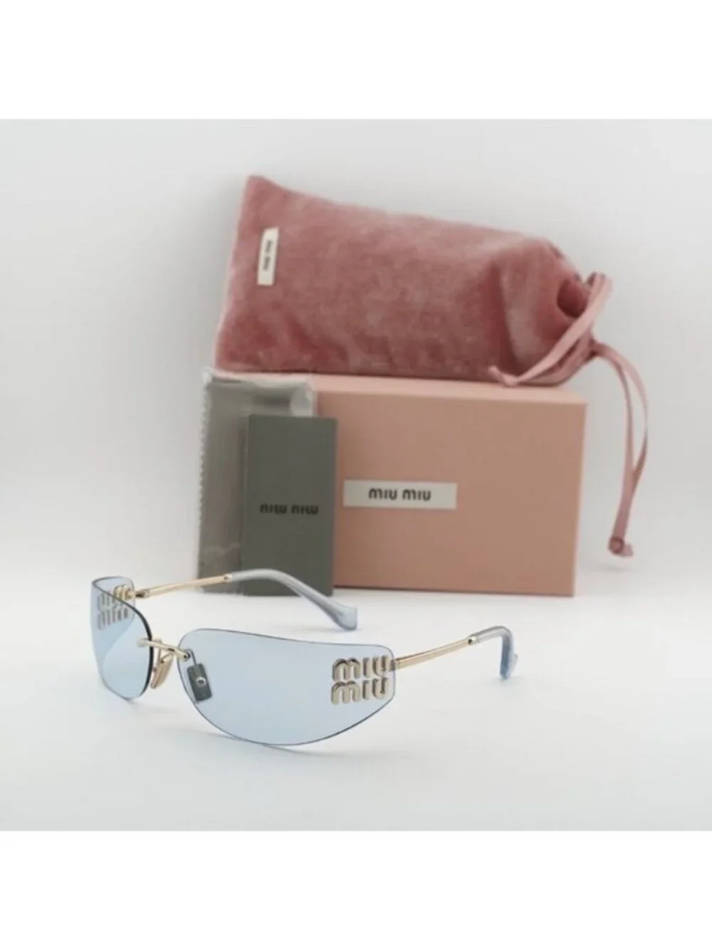 Miu Miu MUA51S ZVN10P Sunglasses Pale Gold Rectangle Frame, Light Blue Lenses
